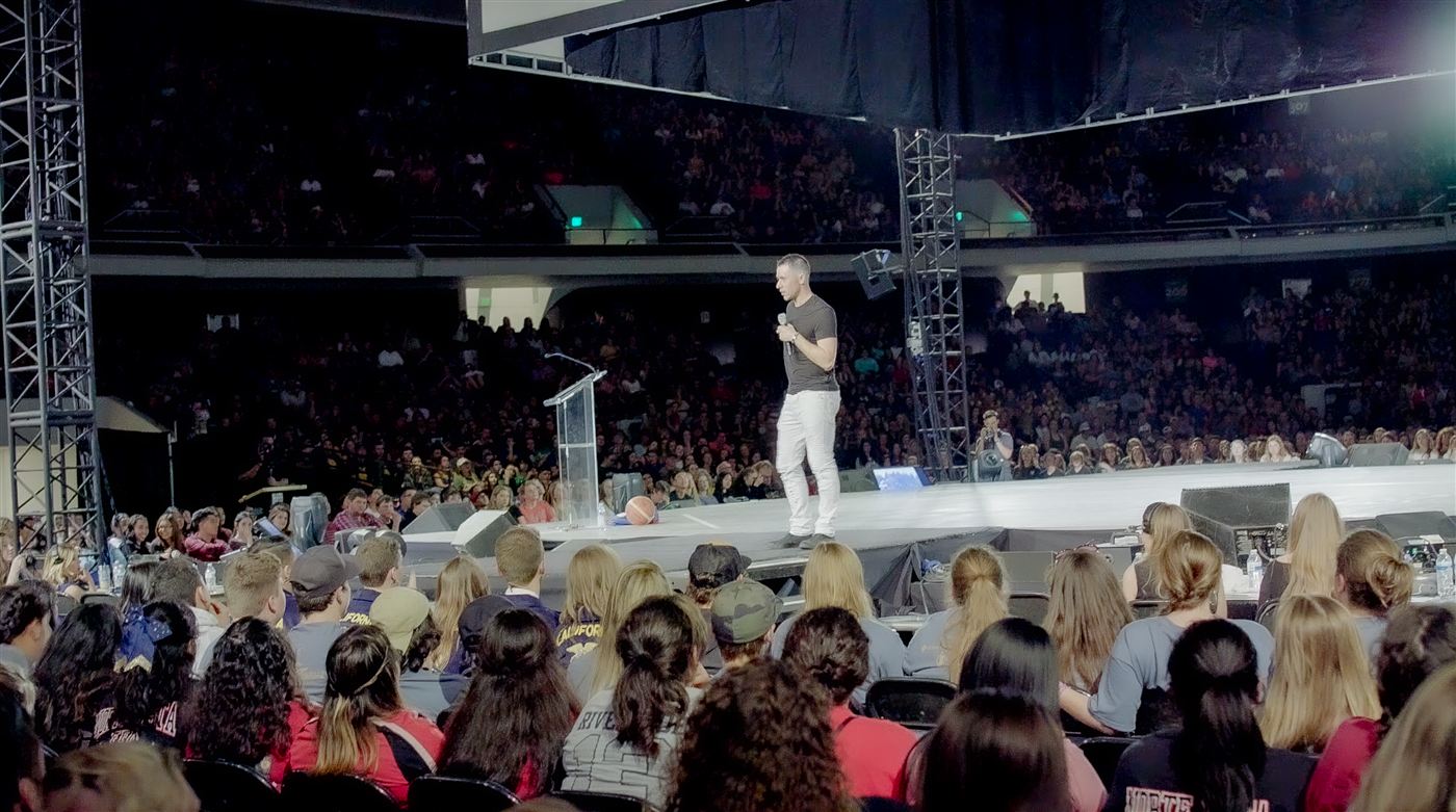 Jesse LeBeau speaking to a stadium of students