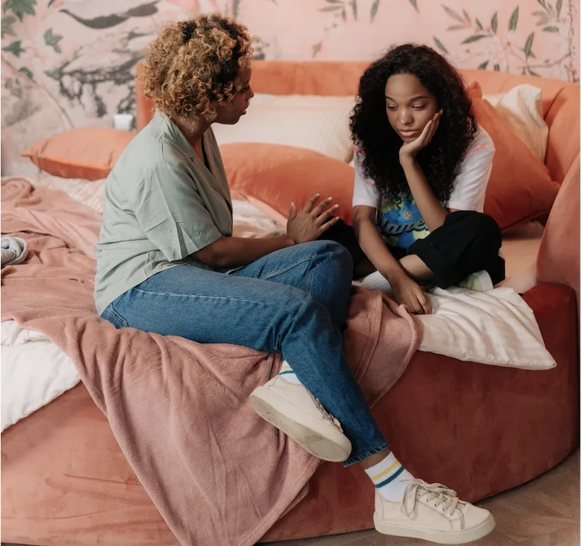 A mother talking with her teenage daughter